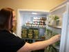 A staff member at DeSoto Memorial Hospital checks the fresh produce available at the Wellness Market
