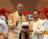 H.H. Dr. Prince Mario-Max Schaumburg-Lippe, left, receives the "Key to the Heart" from Dr. Hong after he rang the Bell of World Peace and Love.