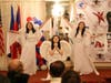 FOWPAL members, dressed as angels, perform “Children from Heaven,” encouraging everyone to illuminate their inner lights and bless the world with love.