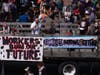 Protesters gather near Fruitvale's BART station to protest on Friday, May 1.