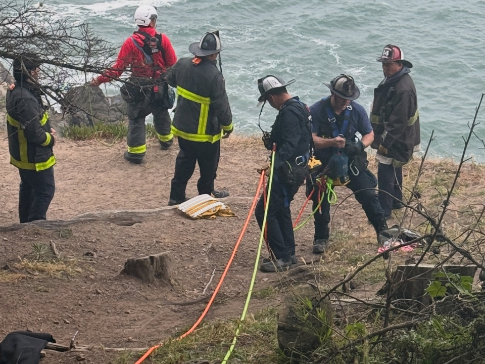 Fire crews conduct a cliff rescue. 