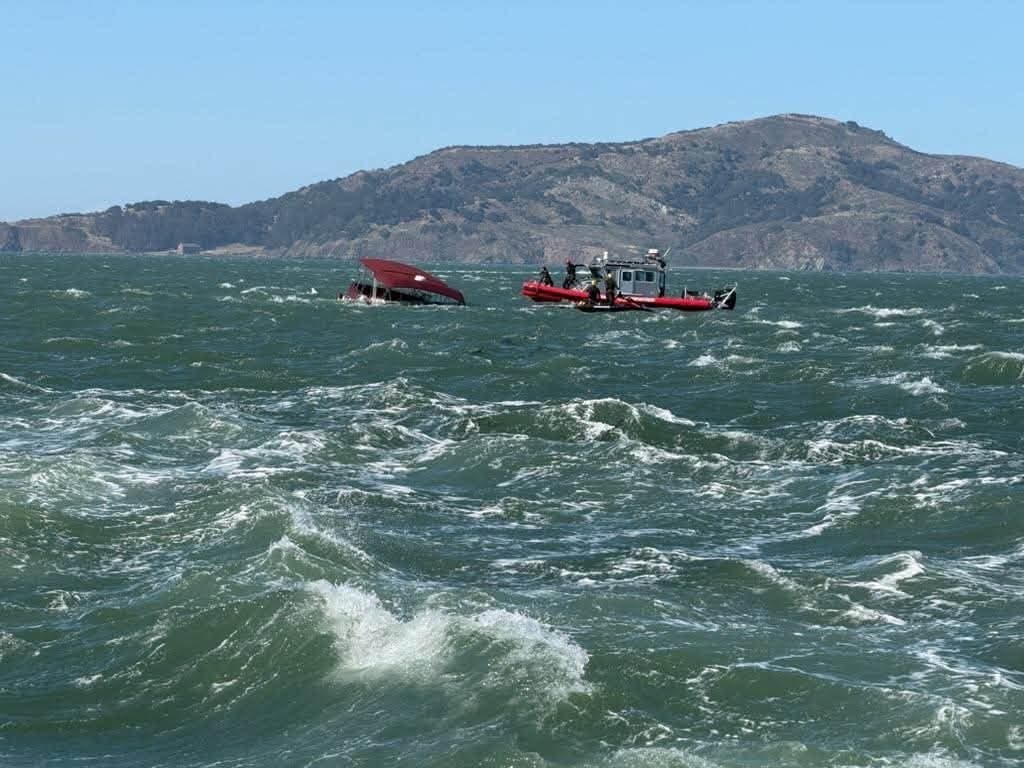 A boat sinks in the San Francisco Bay on Tuesday, July 14.