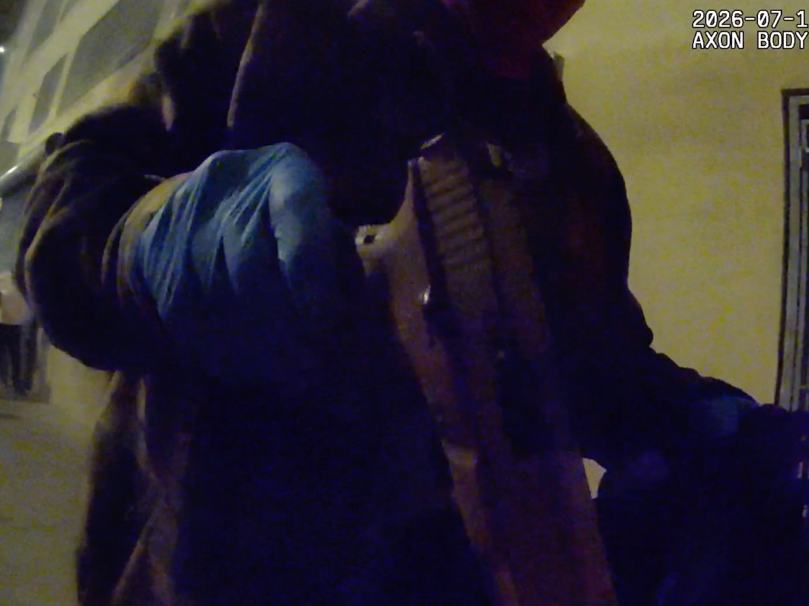 Police seize evidence from a car they say the suspects used during a robbery on July 15.