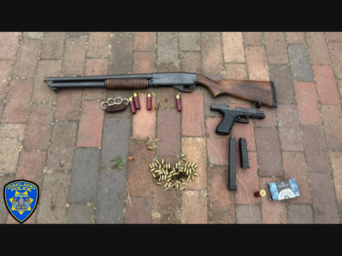 Guns and brass knuckles seized during an investigation in Oakland that started with a standoff between officers and a shooting suspect. 