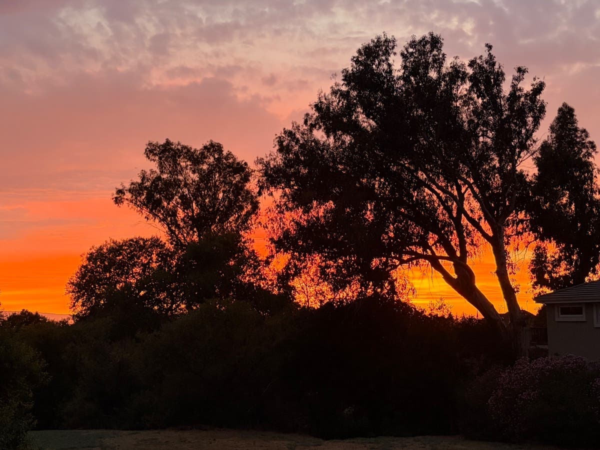 A photo of a sunset over some hills in Fremont.