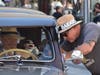 A man in a lowrider speaks with another man during the annual King of the Streets event on Saturday, Sept. 19. 