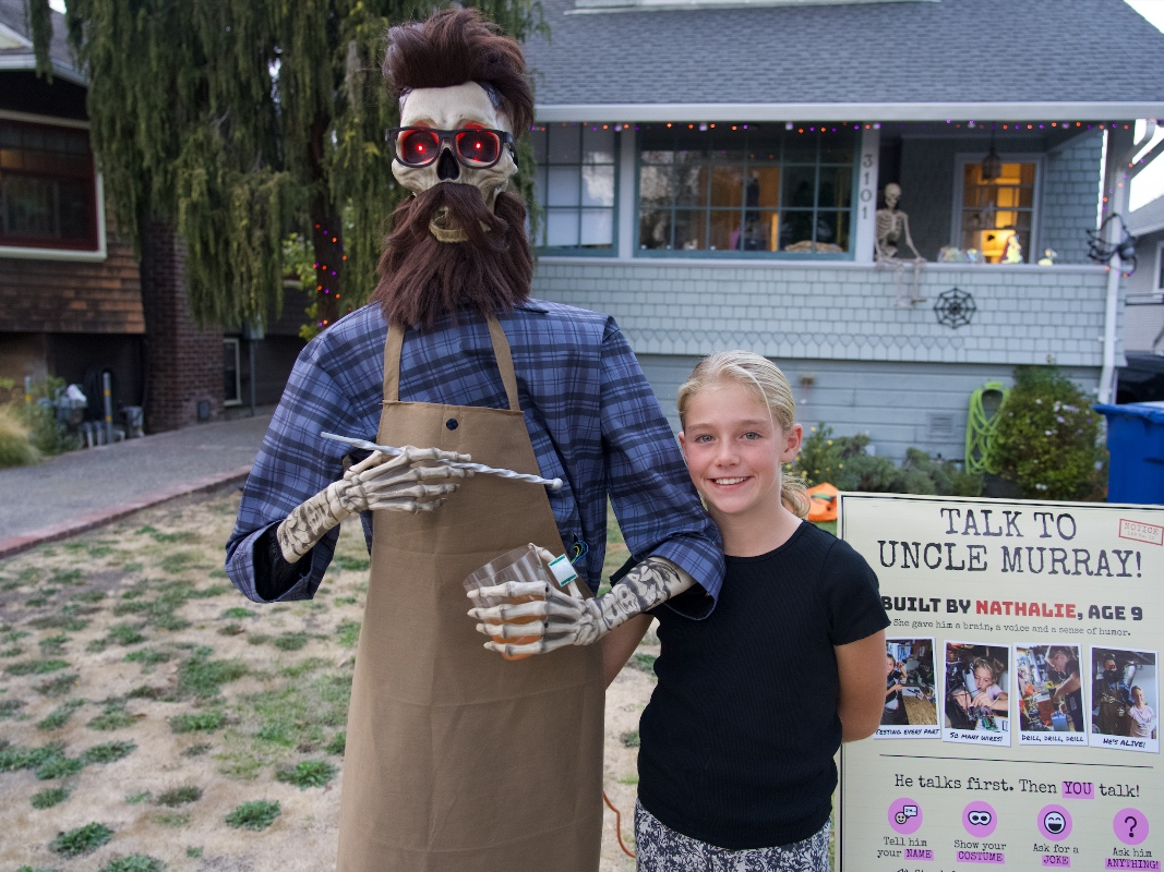 Nathalie Chabas stands next to "Uncle Murray," a skeleton she customized with AI to have conversations with people. 