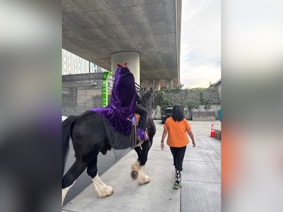 The headless horseman rides through a BART station in Oakland. 