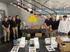 Members of the Lincoln-Way Lancers Hockey Club's JV1 team proudly displaying their team's collection for their FOOD DRIVE game.