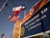 BROWNSVILLE, TEXAS – FEBRUARY 24: The U.S. and Texas flags fly near the U.S.-Mexico border on February 24, 2021 in Brownsville, Getty Images