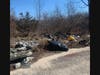 Garbage piles up just steps away from where patients are cared for at Pilgrim Psychiatric Center.