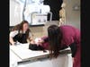 Kate Marcoullier, Radiologic Technology program coordinator at NHTI, teaches students how to use x-ray equipment in one of the college's medical imaging labs.