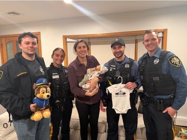 Wayne Police Officers Amundson, Sole, Struble, and Kirby were joined by EMTs and paramedics to help deliver baby Theo on March 20. 