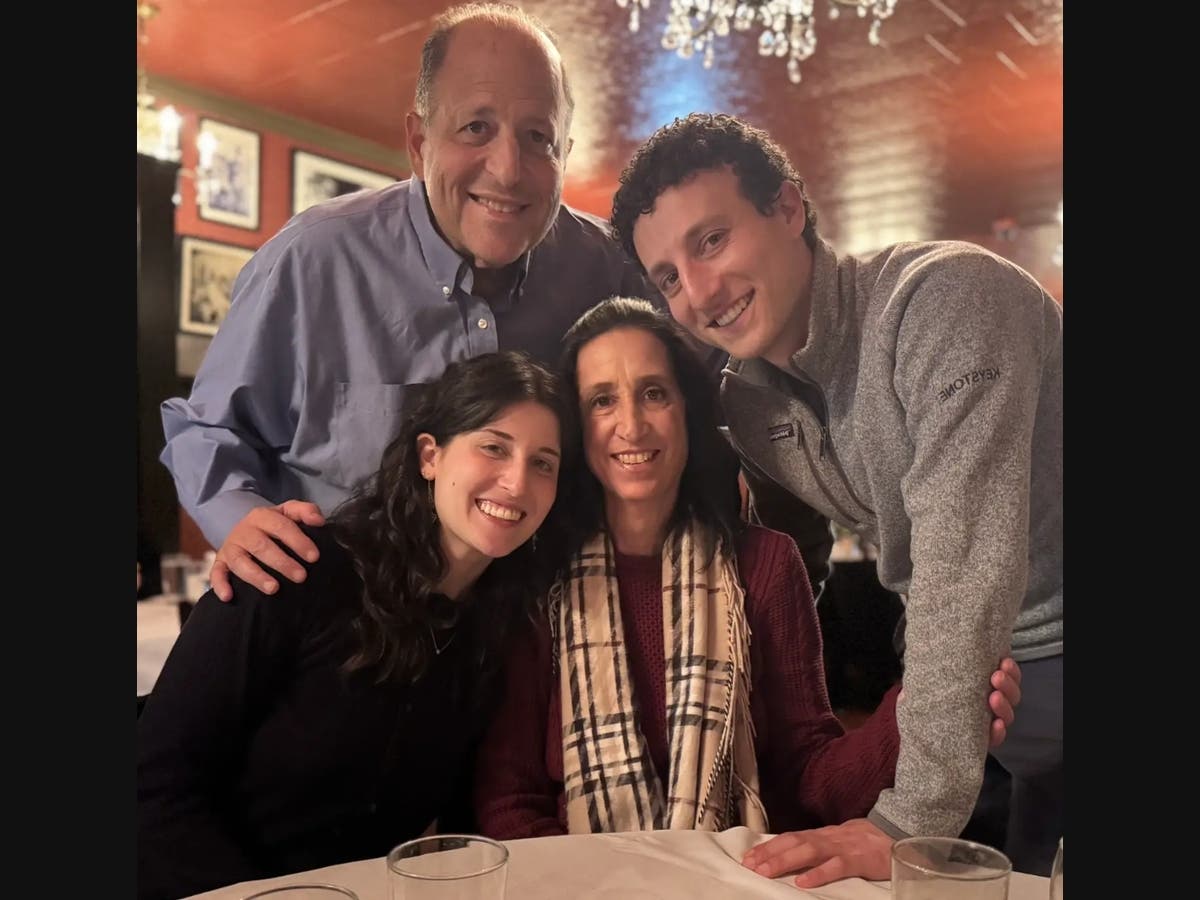 Mark Whitmore with his two children and wife. 