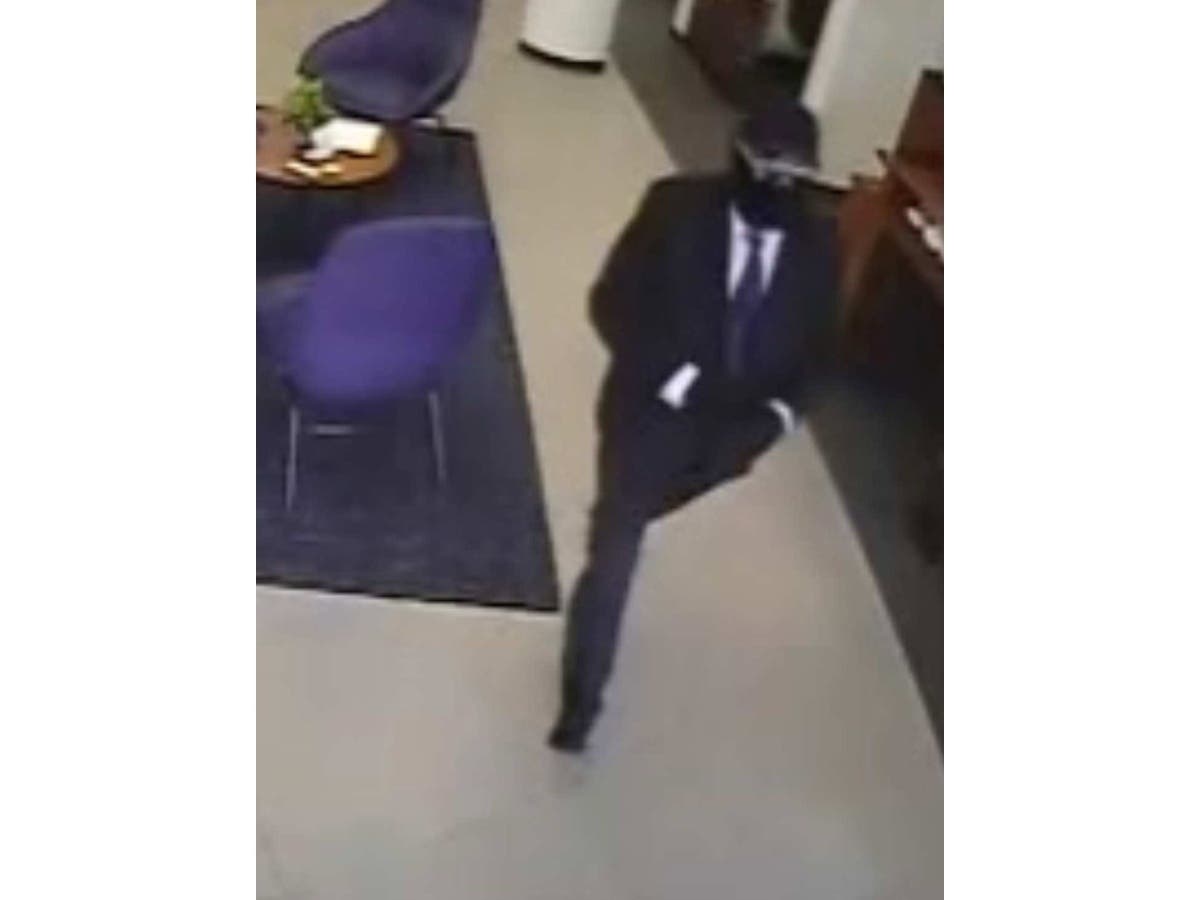 The masked robber is believed to be a white man in his 50s, police say.