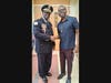 Commander Gregory Jackson of the Chicago Police Department's 5th District and Andre Brown of the Healing Academy and the Art Center of Englewood.