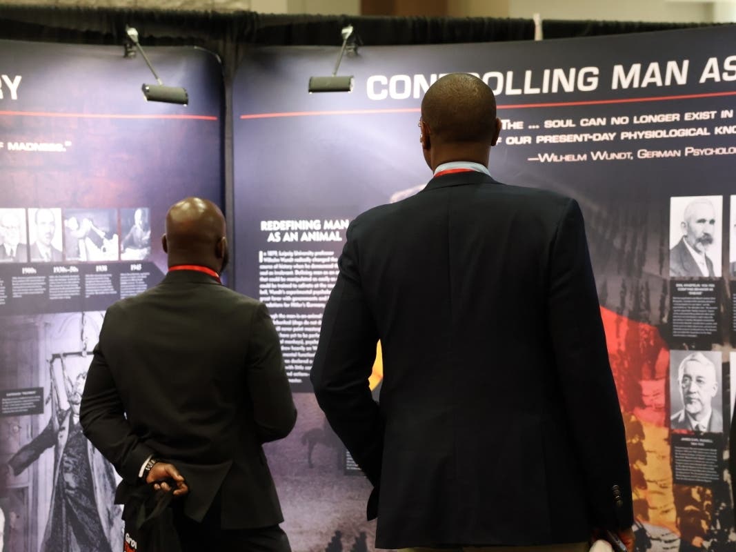 Two attendees view the Citizens Commission on Human Rights traveling exhibit at the Congressional Black Caucus Foundation’s 55th Annual Legislative Conference in Washington, DC.