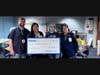 Associates from two local Walmart stores present Perry Meridian Middle School in Indianapolis with a $1,500 donation and supplies for Teacher Appreciation Week. 