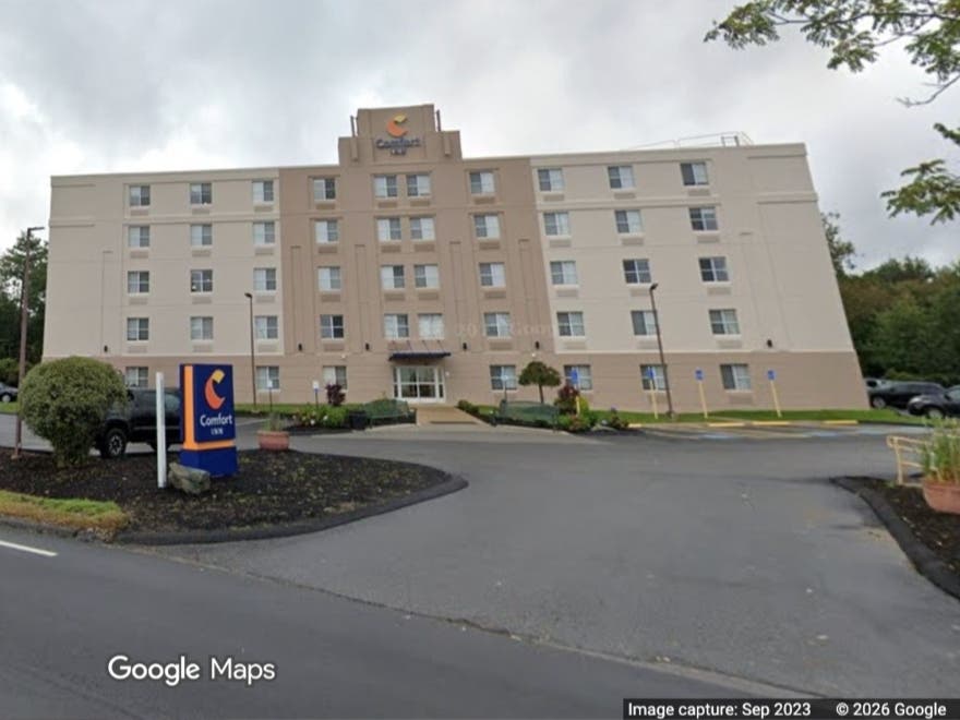 A man is facing charges in Milford after roaming around a hotel naked and intoxicated, according to police.