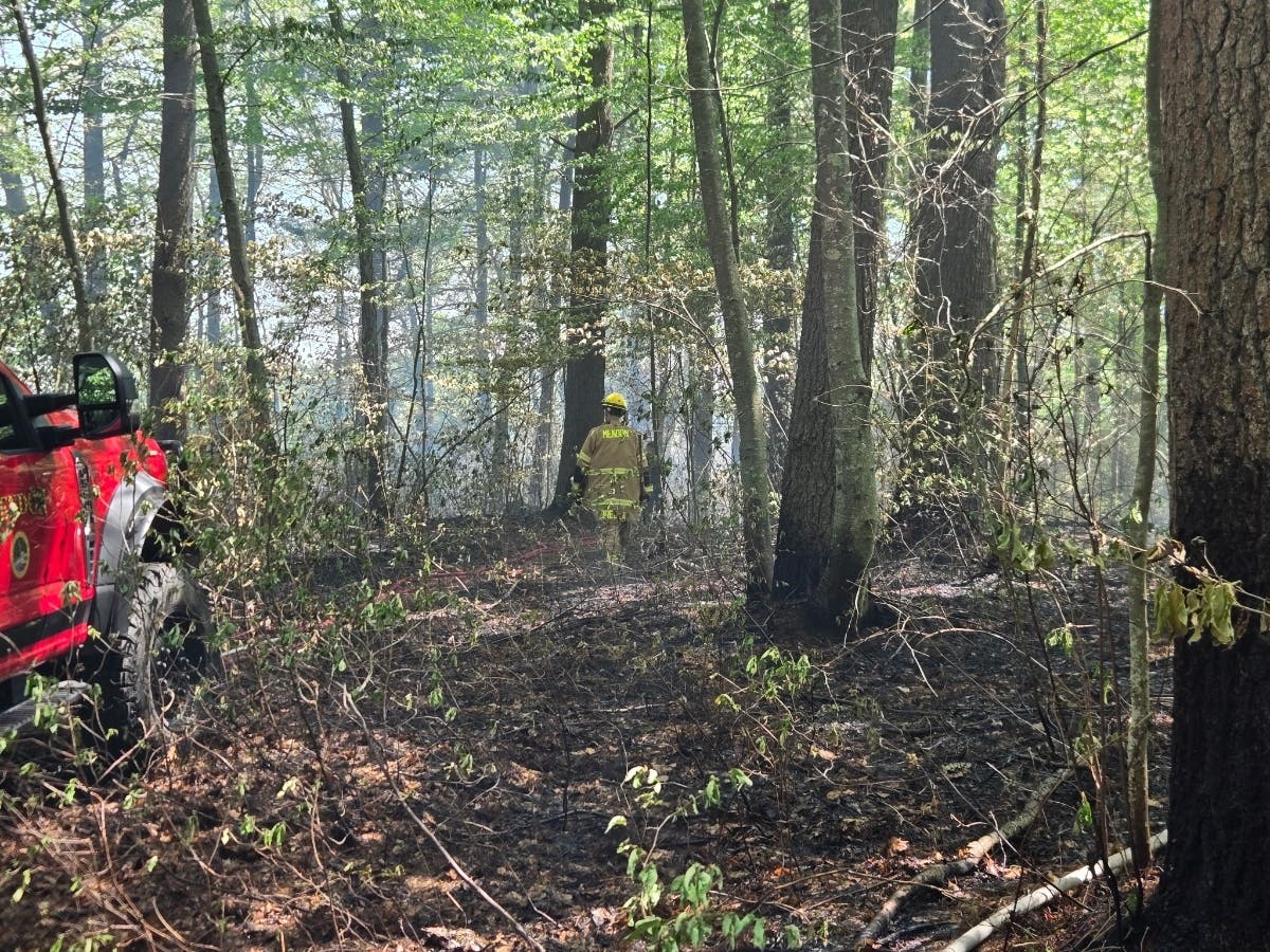 A brush fire in the Hopedale Parklands on Monday drew multiple fire departments and burned 1.25 acres.