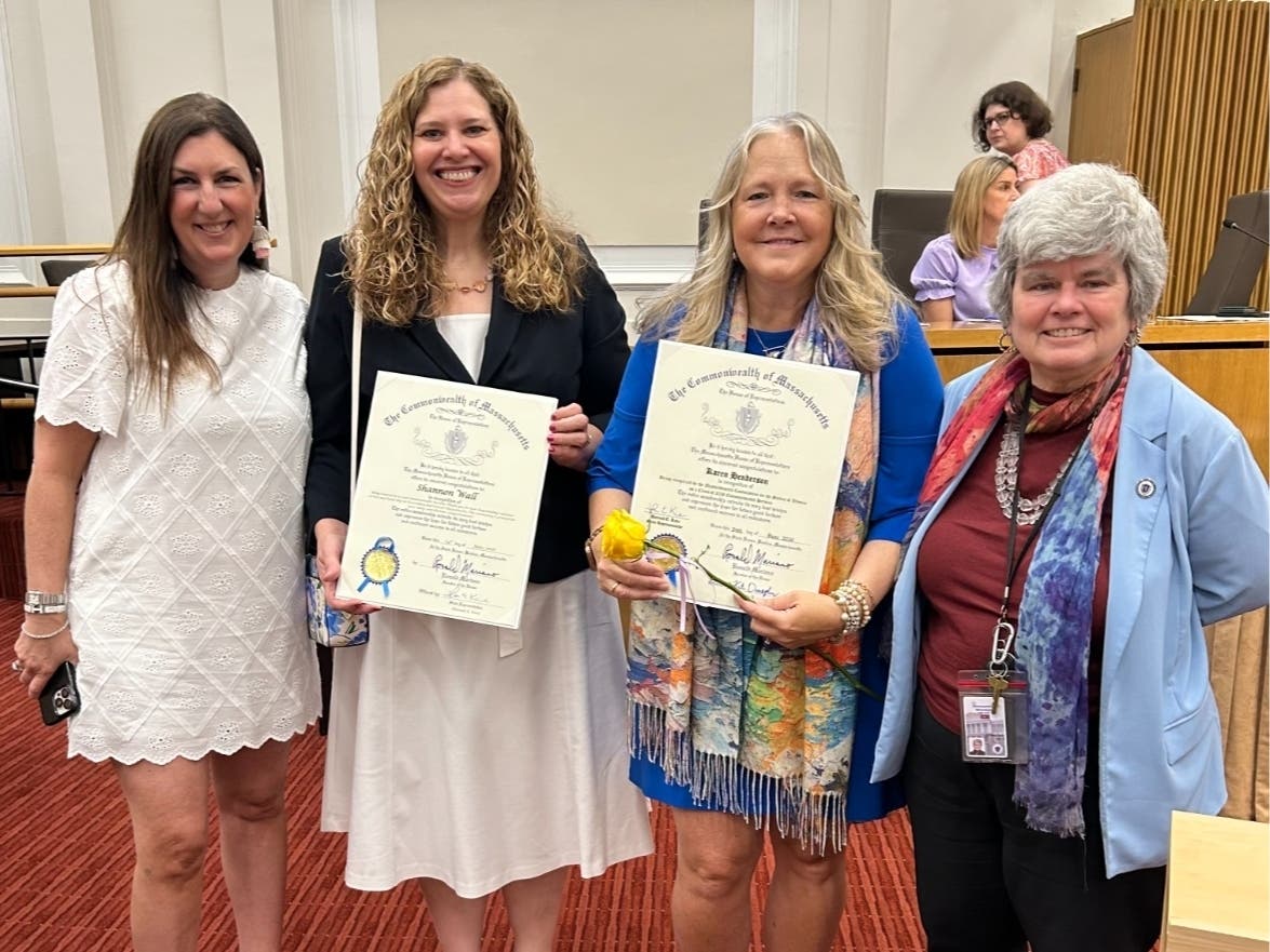 Rep. Hannah Kane, Shannon Wall, Karen Henderson, Rep. Kate Donaghue at a ceremony at the Massachusetts State House's Gardner Auditorium in Boston.