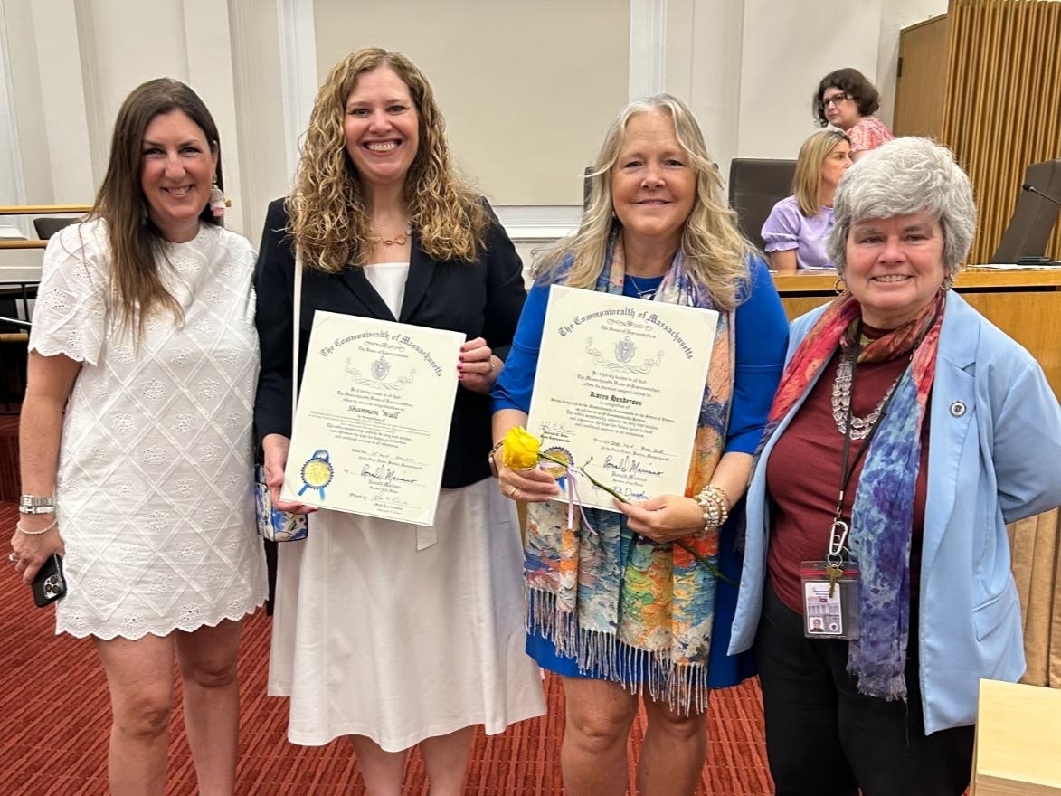 Rep. Hannah Kane, Shannon Wall, Karen Henderson, Rep. Kate Donaghue at a ceremony at the Massachusetts State House's Gardner Auditorium in Boston.