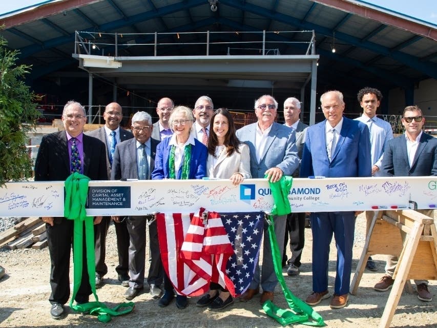 Quinsigamond Community College held a topping-off ceremony on Monday to celebrate the completion of the QCC Center's structural frame.