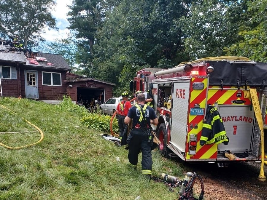 Wayland firefighters were working to contain a second-alarm house fire on Peck Avenue Friday afternoon.