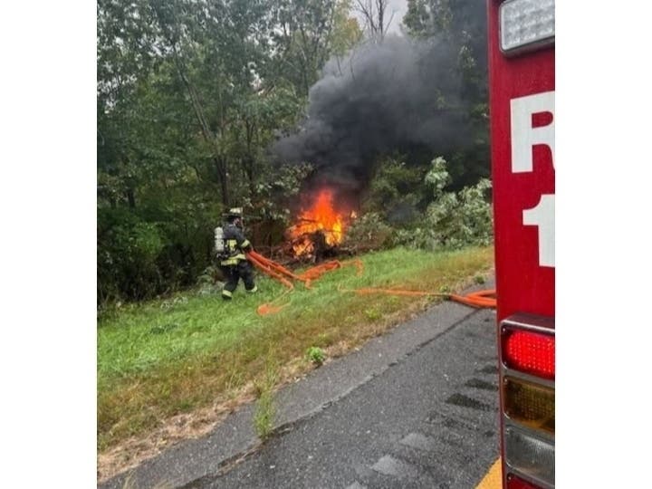 A vehicle erupted in flames after crashing off I-290 in Shrewsbury on Sunday.