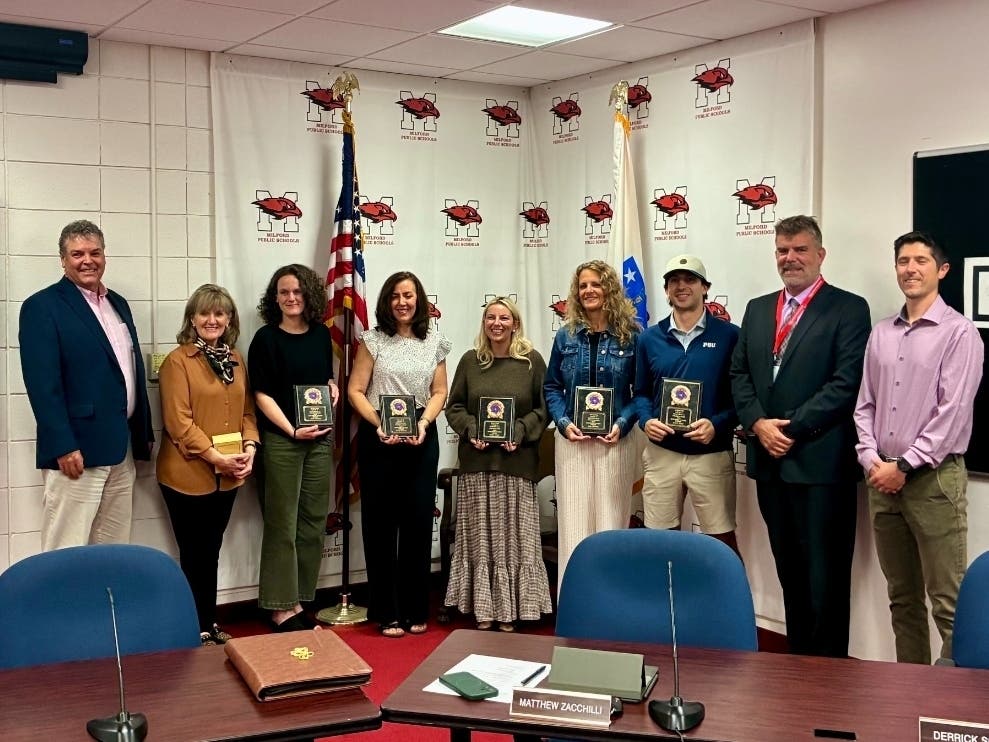 MPS Outstanding Teacher of the Year Lisa Rizoli poses with David Bertonazzi, Annie Ablondi, Kelly Selander, Jillian Lynch, Amy Riordan, Austin Costa, Superintendent Craig Consigli, and School Committee Vice-Chair Brendan Rickert during a meeting on Oct 1.