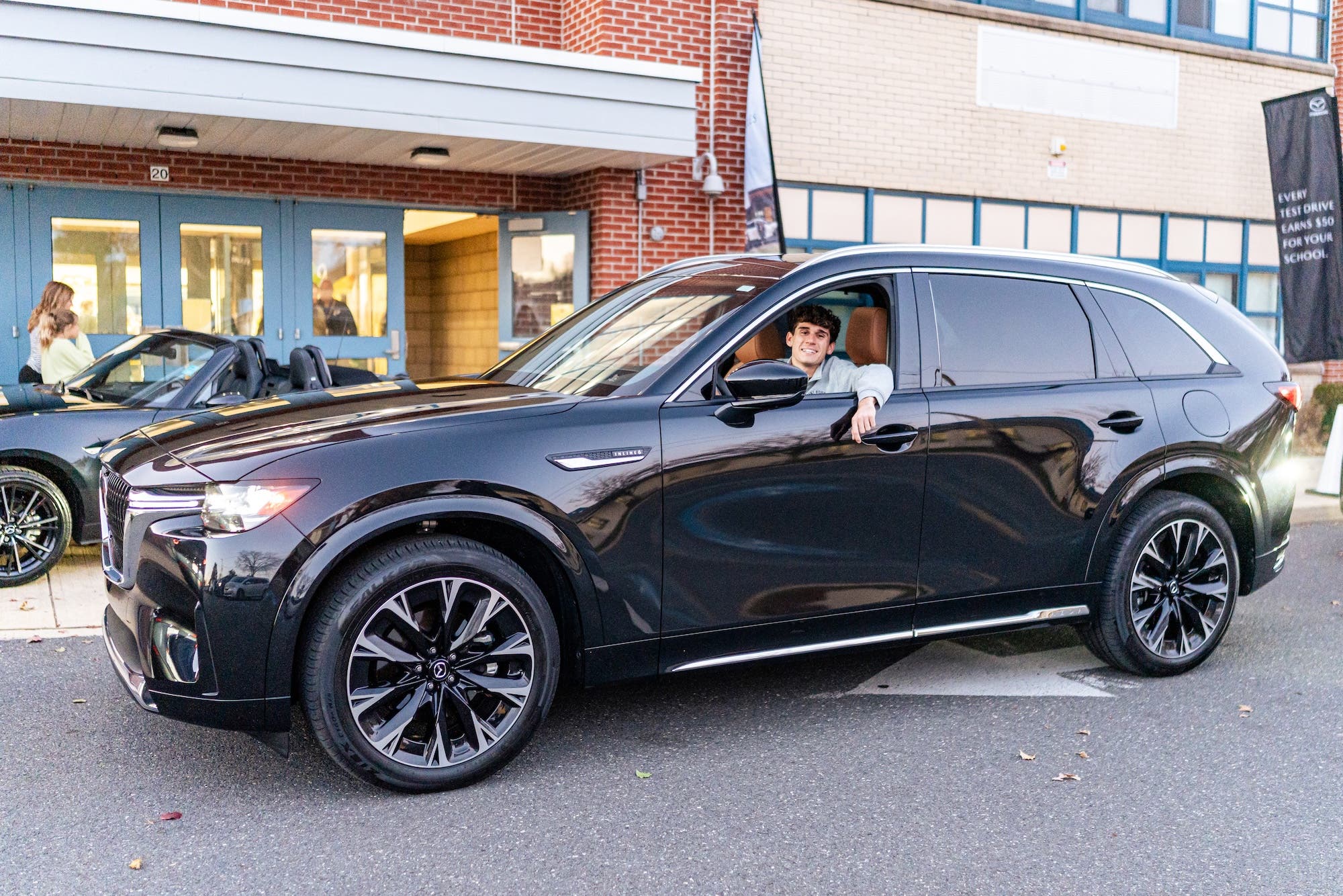 Serra Mazda Brighton Be Moved Drive Program Event at Holly High School
