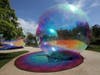 On Wednesday June 3, 2026, artists put the finishing touches Wednesday on Evanescent, the immersive bubble-inspired sculpture installation now dubbed “Shimmering Summer” at the Chicago Botanic Garden. Show opens Saturday. 
