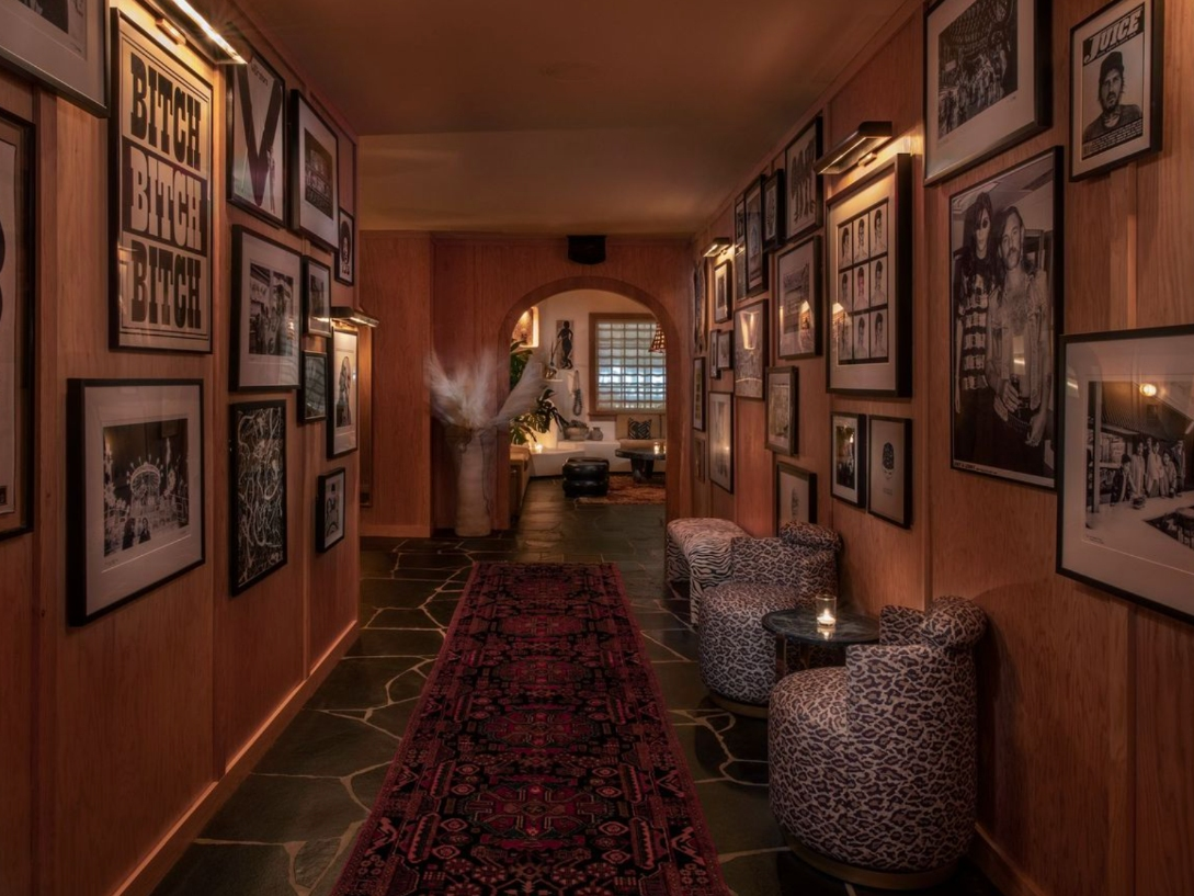 Hollywood history greets guests in the famed entry hallway at The Bungalow Kitchen in Long Beach.