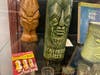 Tiki idol mugs and evocative matchbook covers displayed at the “Intriguing Idols & Enchanting Exotica: The Age of Tiki in Postwar America” at Huntington Public Library.
