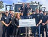 Gameday Men's Health Arrowhead Ranch presents a check to the Glendale Firefighters Charities