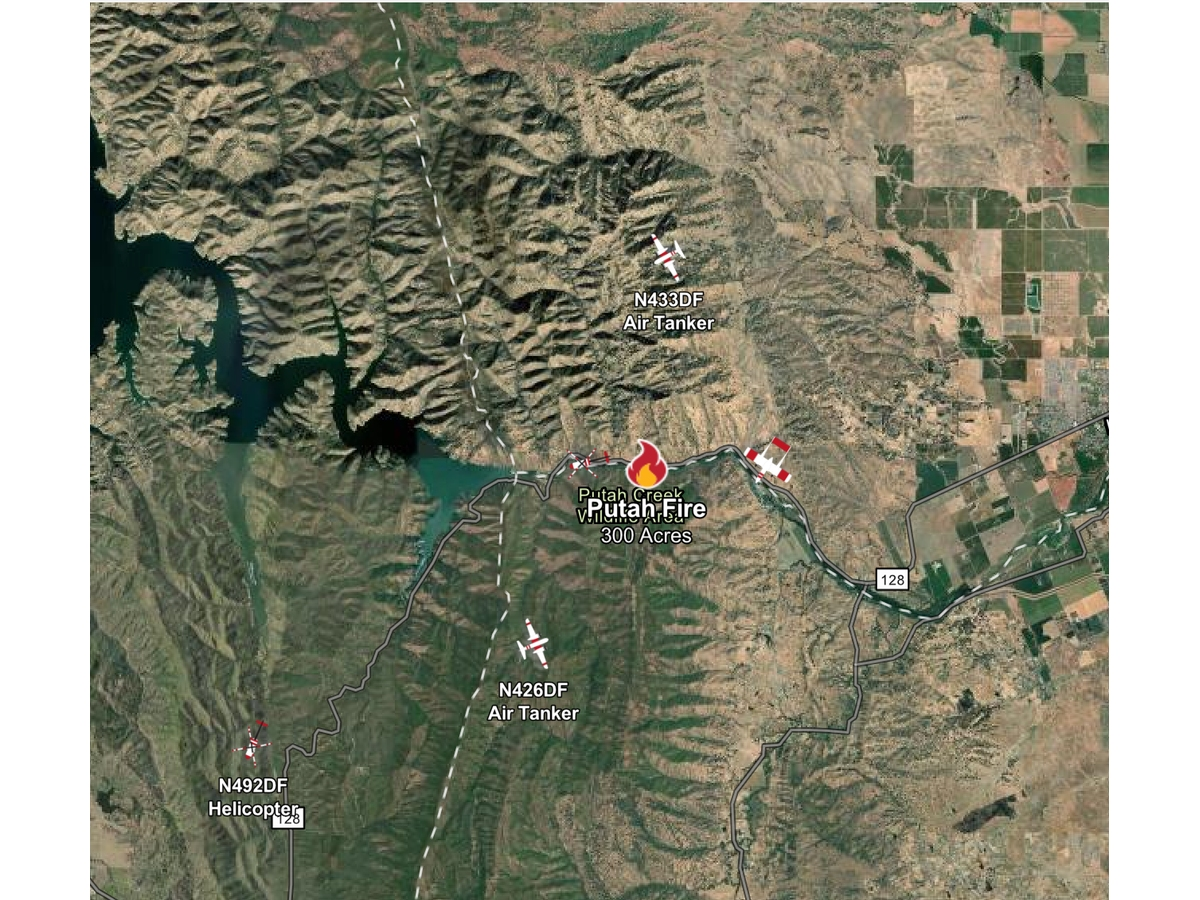 A rapidly growing wildfire west of Winters has closed Highway 128 in both directions near Monticello Dam, burned roughly 300 acres, and prompted an aggressive regional response.