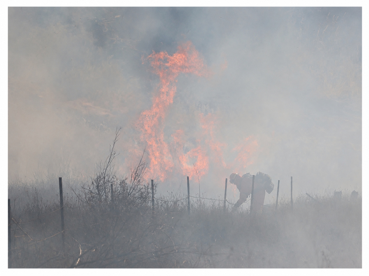 The cause of the Head Fire remains under investigation as crews contain the blaze that started Monday. 