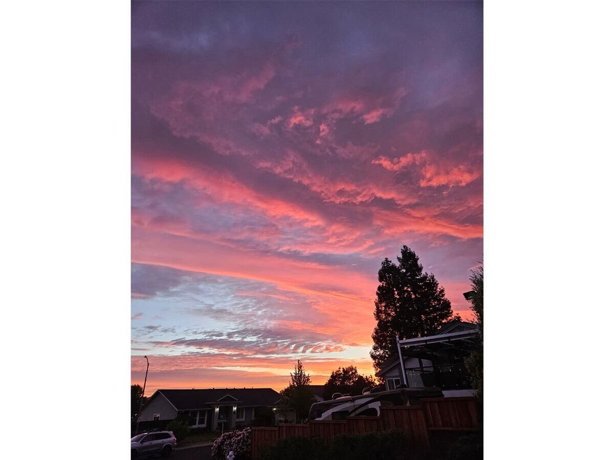 Evening clouds reflected the setting sun, producing a striking display of pink, lavender, and orange hues in this photo of Concord on Monday evening.