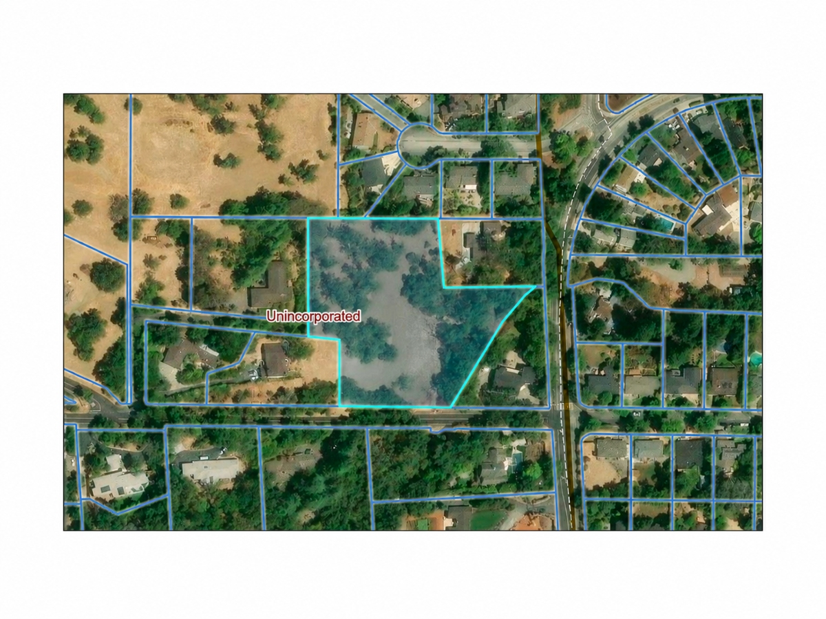 A long-vacant corner property near Pleasant Hill Road could become three home sites if county officials approve the proposal.
