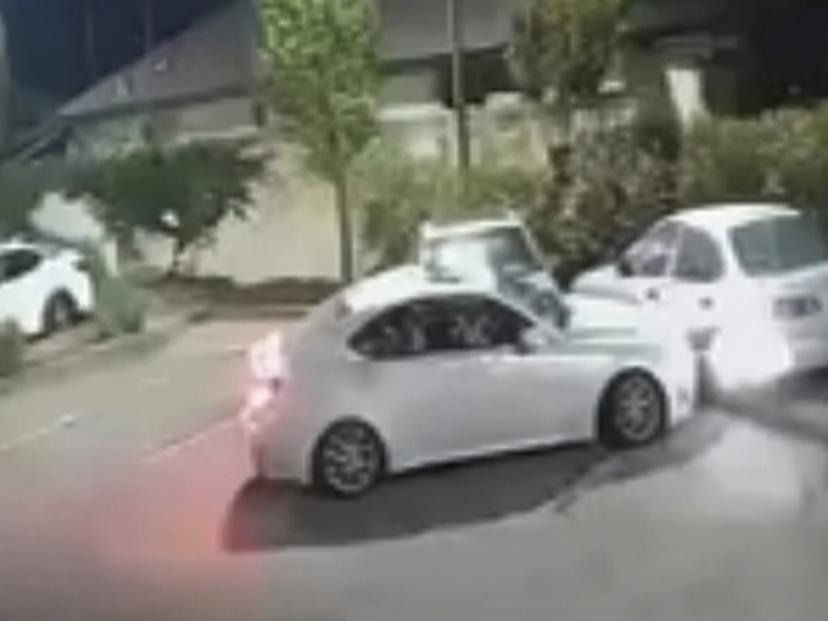 A late-night crash left behind damaged vehicles, a broken fire hydrant, and investigators searching for the driver.