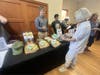 A Geyserville resident before a SMART meeting to hear about plans to build a station in the the town examines the swag offered by the agency. 
