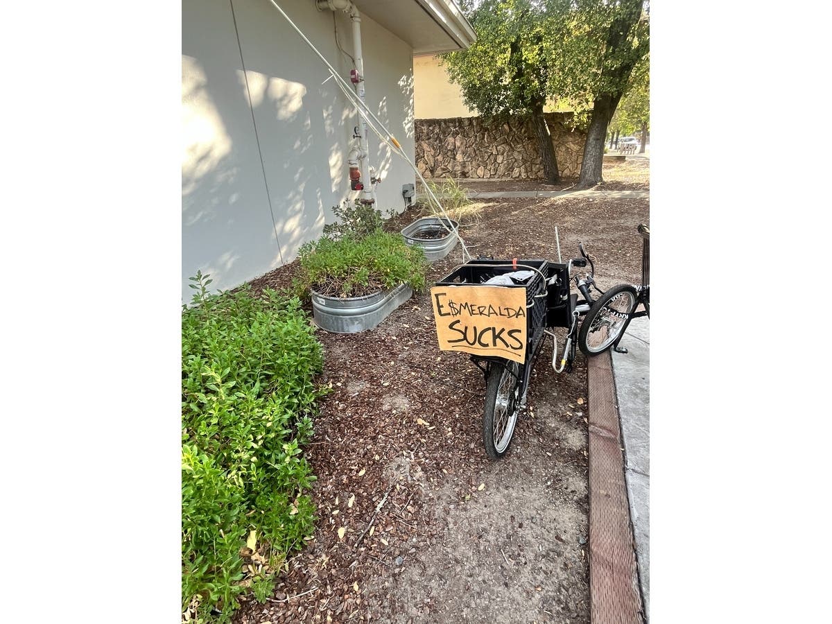 A bike (above) outside the Cloverdale Veterans Memorial Building before a Aug. 20, 2026 community meeting to discuss the Esmeralda development seeking land in Cloverdale for a sprawling and controversial campus. 