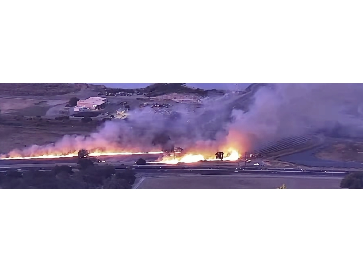 The vegetation fire grew from 2.5 acres to four acres before crews stopped its forward progress.