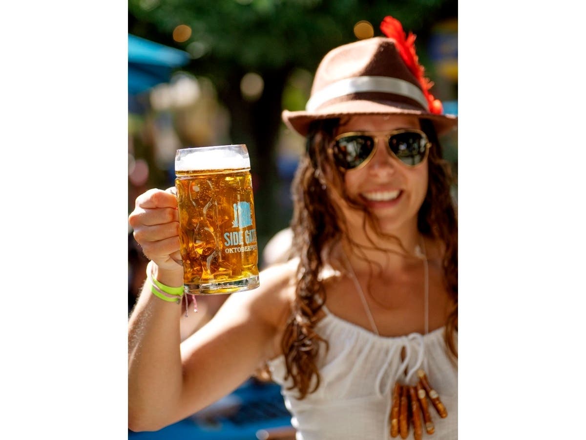 A signature Side Gate Brewery stein and first stein pour await attendees as part of their admission ticket into an Oktoberfest celebration.