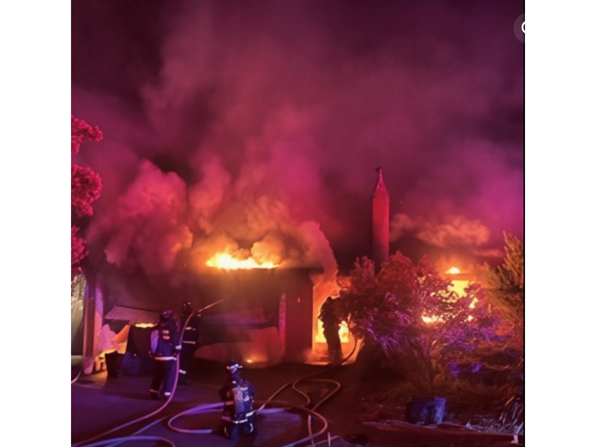 Flames engulfed the home and garage before three neighboring fire agencies joined the fight.