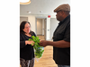 Abode Services Heritage House resident Martha Macías with coordinate Trev Williams harvesting romaine lettuce grown in a Flex Farm in Napa. The program helps stretch residents' budgets with fresh produce and calls attention to Hunger Action Day today. 