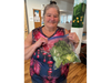 Sherry Allen with romaine lettuce harvested from a hydroponic Flex Farm garden at the Abode Services Heritage House in Napa on Sept. 24, 2026. 