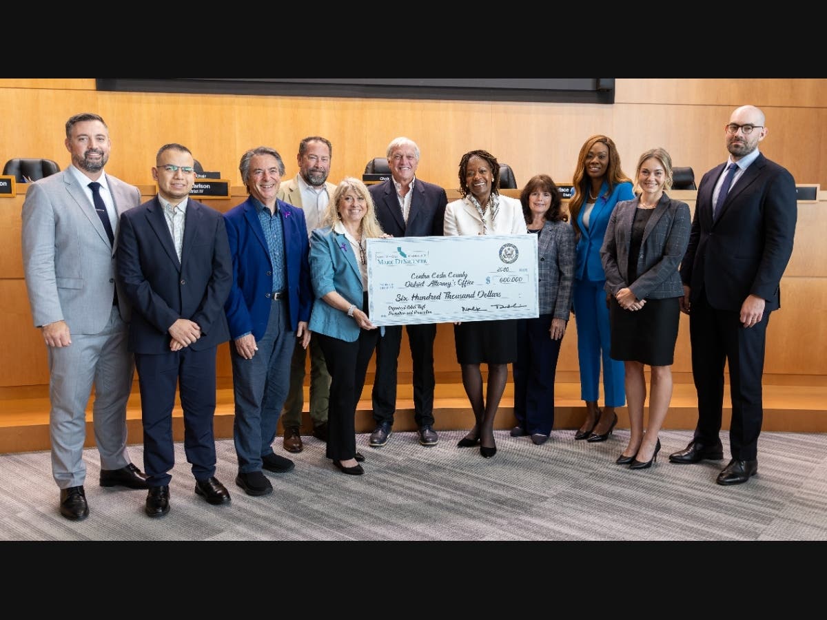 Rep. Mark DeSaulnier presented two checks supporting retail theft prosecutions and services for labor trafficking survivors (above) that were part of $8.3 million appropriated by DeSaulnier and Rep. John Garamendi.