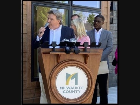 Brian Spoerl on ribbon cutting day at his Whitefish Bay development.