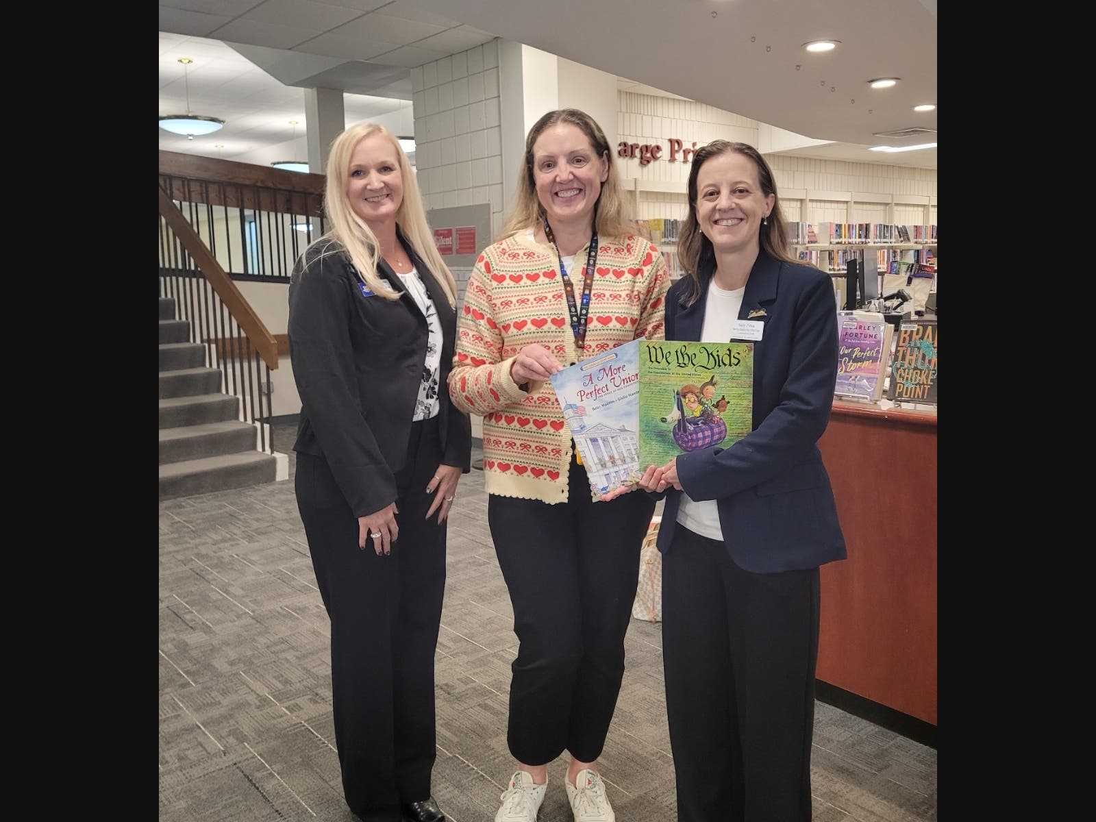 Left to right: chapter librarian Barbara Wells, Trumbull Library director Elizabeth Adams, and chapter regent Sally Finck.